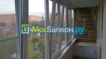 Отделка панорамной лоджии камнем